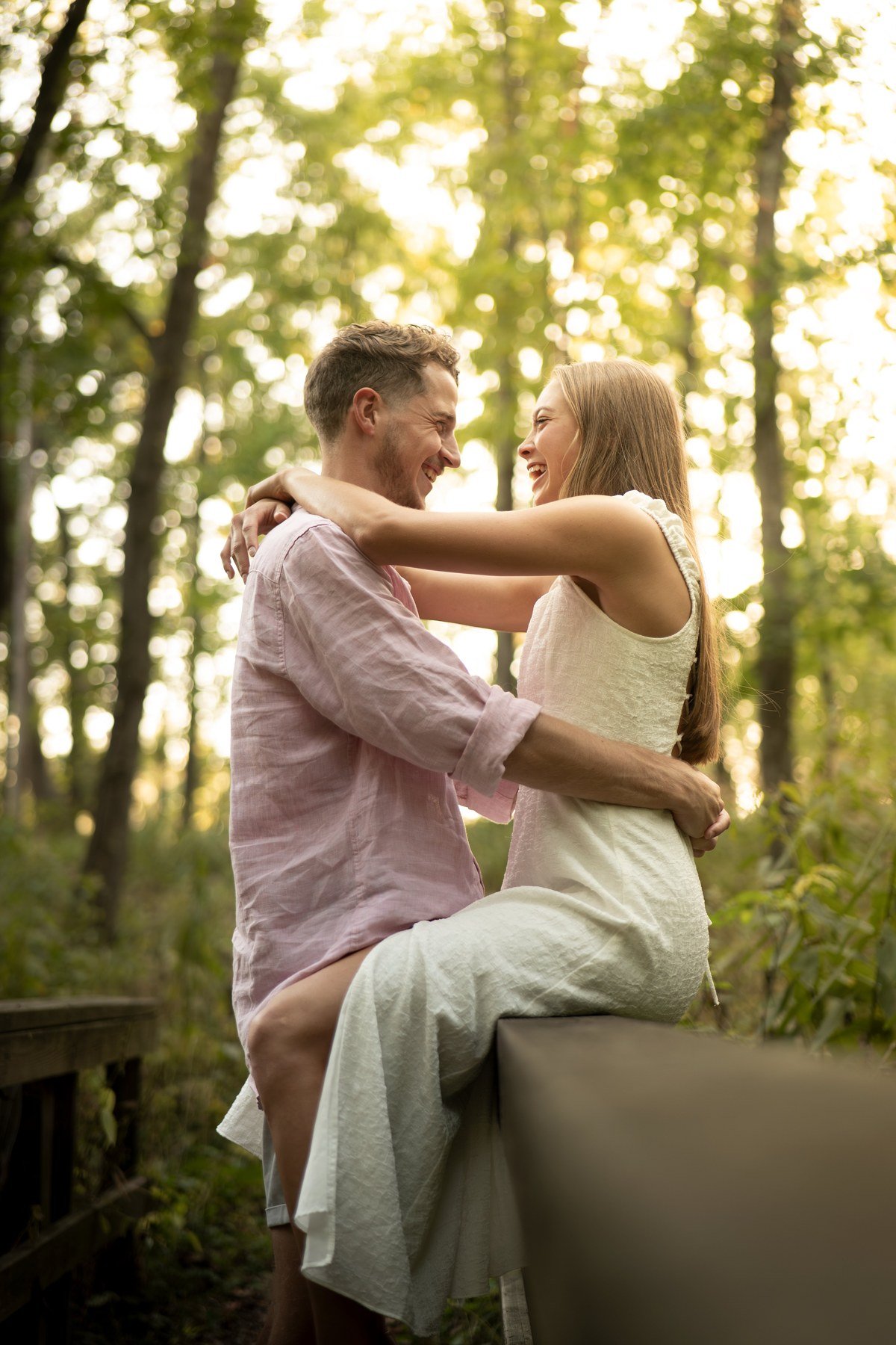 Couple laughing in forest